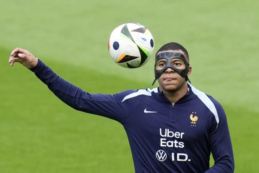 Mbappé Prepares with Mask for France vs. Poland at Euro 2024illustration